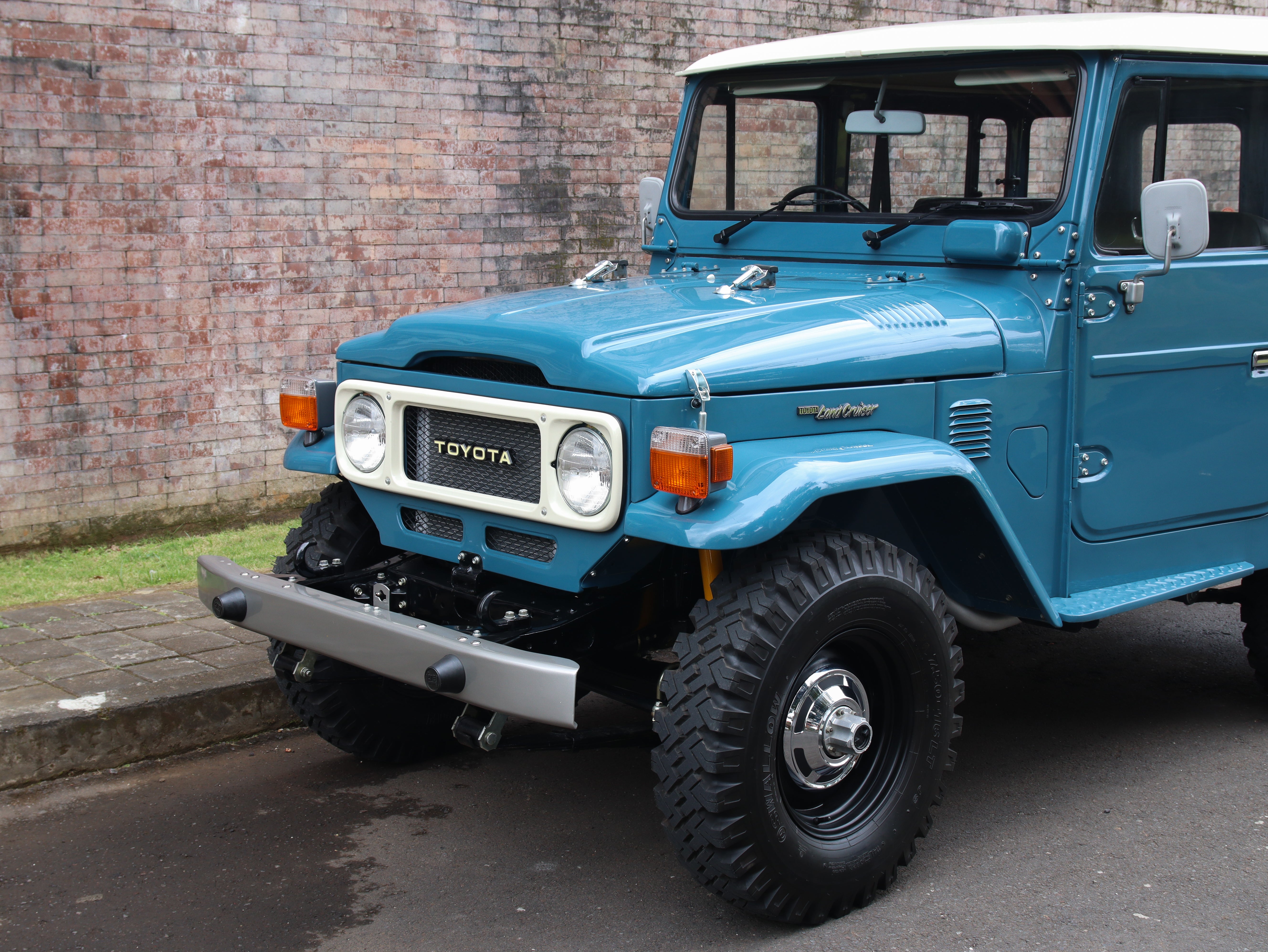 New restored 1982 Toyota FJ40 Land Cruiser in blue, classic 40 series showroom
