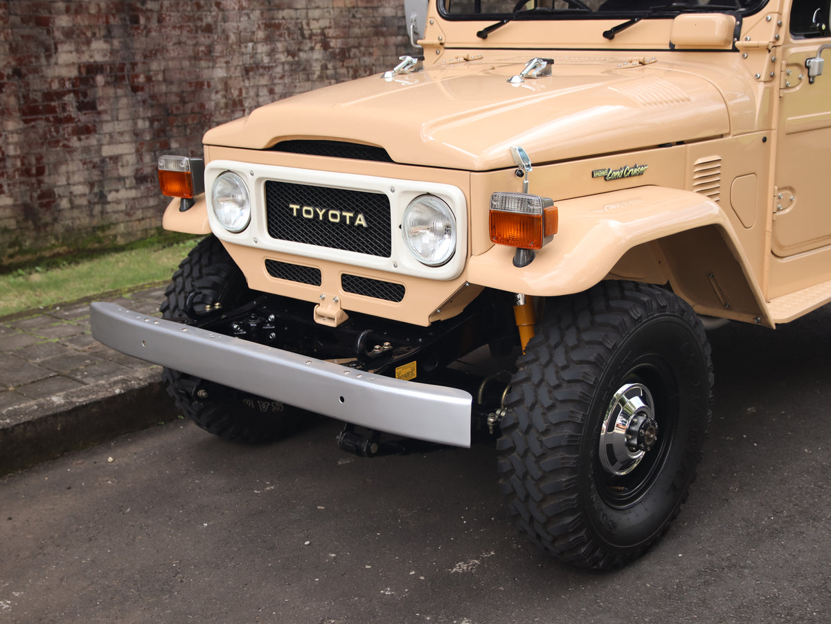 1981 Beige Toyota FJ40 Land Cruiser with 15" Steel Rims GT Radial M/T Tyres and Bulk New Genuine Toyota Parts